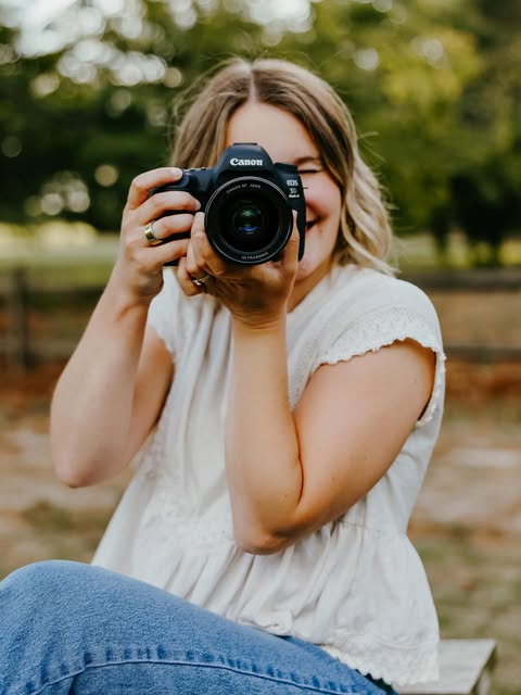 Logan behind her camera